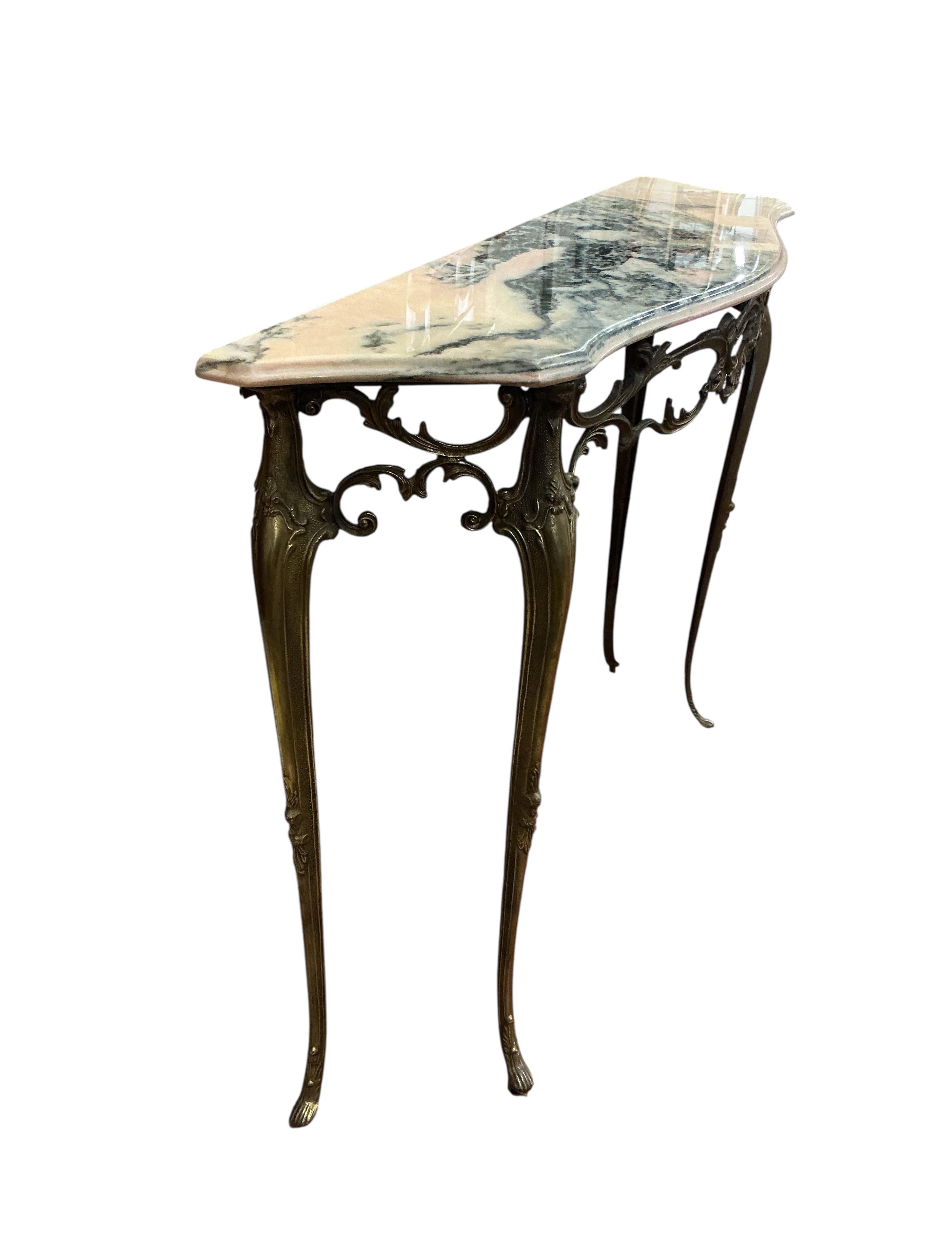 A mid century brass and reconstituted marble serpentine console table, width 90cm, depth 28cm, height 76cm